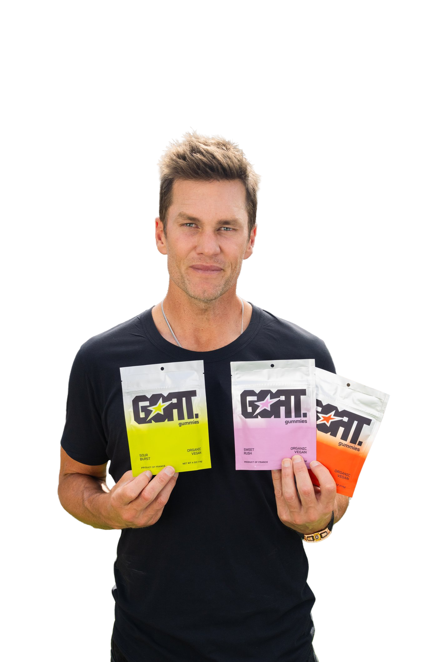 Organic Tom holding three pouches of GOAT Gummies